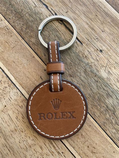 ROLEX SCHLÜSSELANHÄNGER, KRONE, LEDER, .